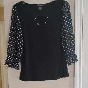 Chic Black Blouse with Polka Dot Sleeves